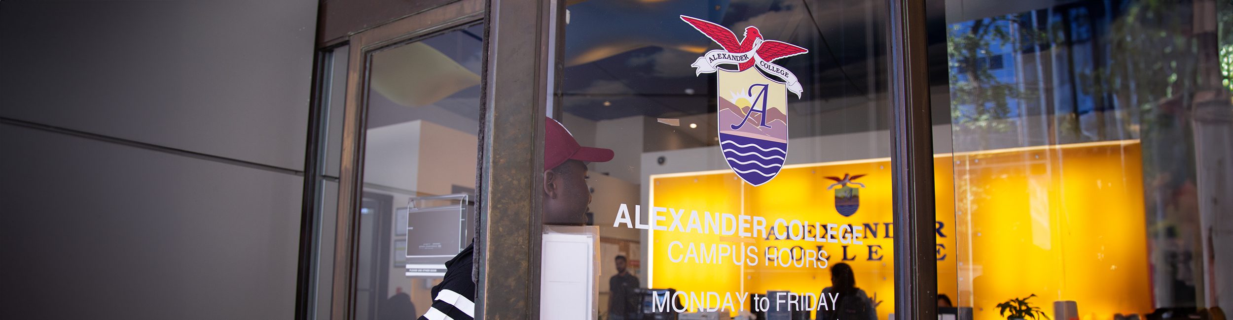 A student opening the door of the Vancouver campus
