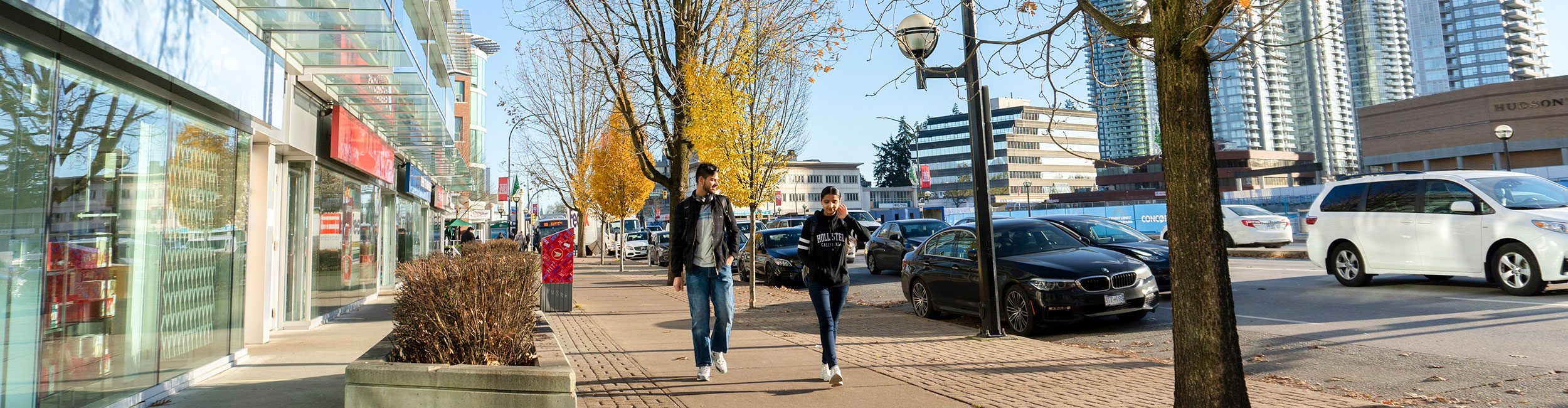 Two students walking outside Alexander College