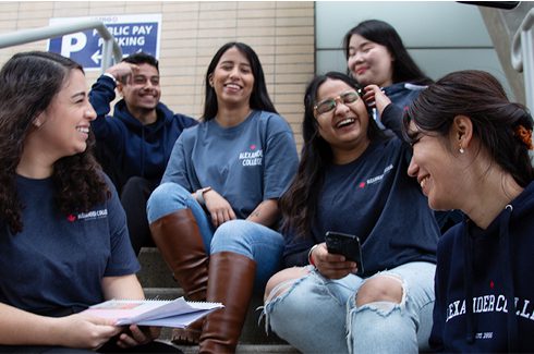 A group of students in Alexander College merch
